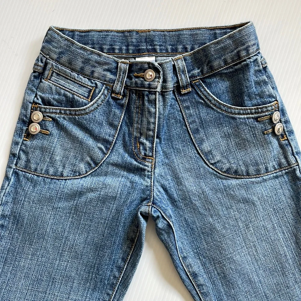 Gymboree flared jeans with gem buttons.  Girls size 7